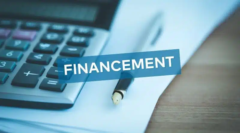 financing coverage? Calculator with a notebook and pen