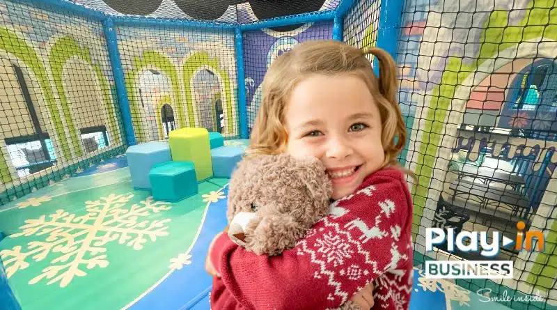 little girl in a frozen-themed playground